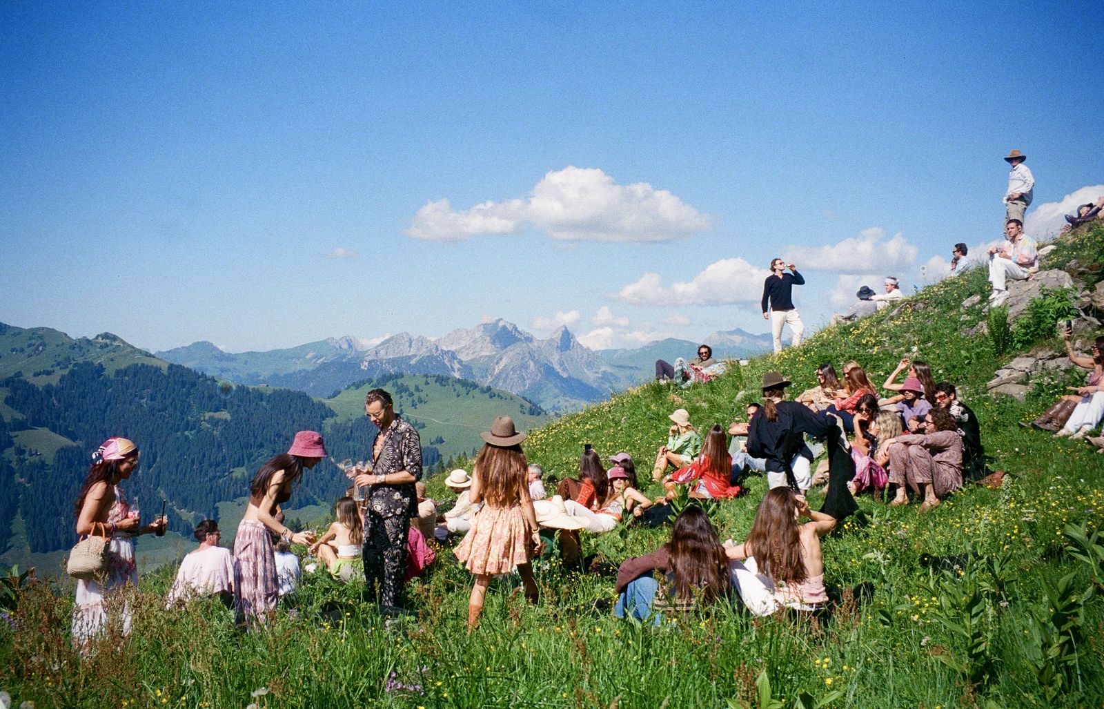 Guests gathered on the hillside above the valley