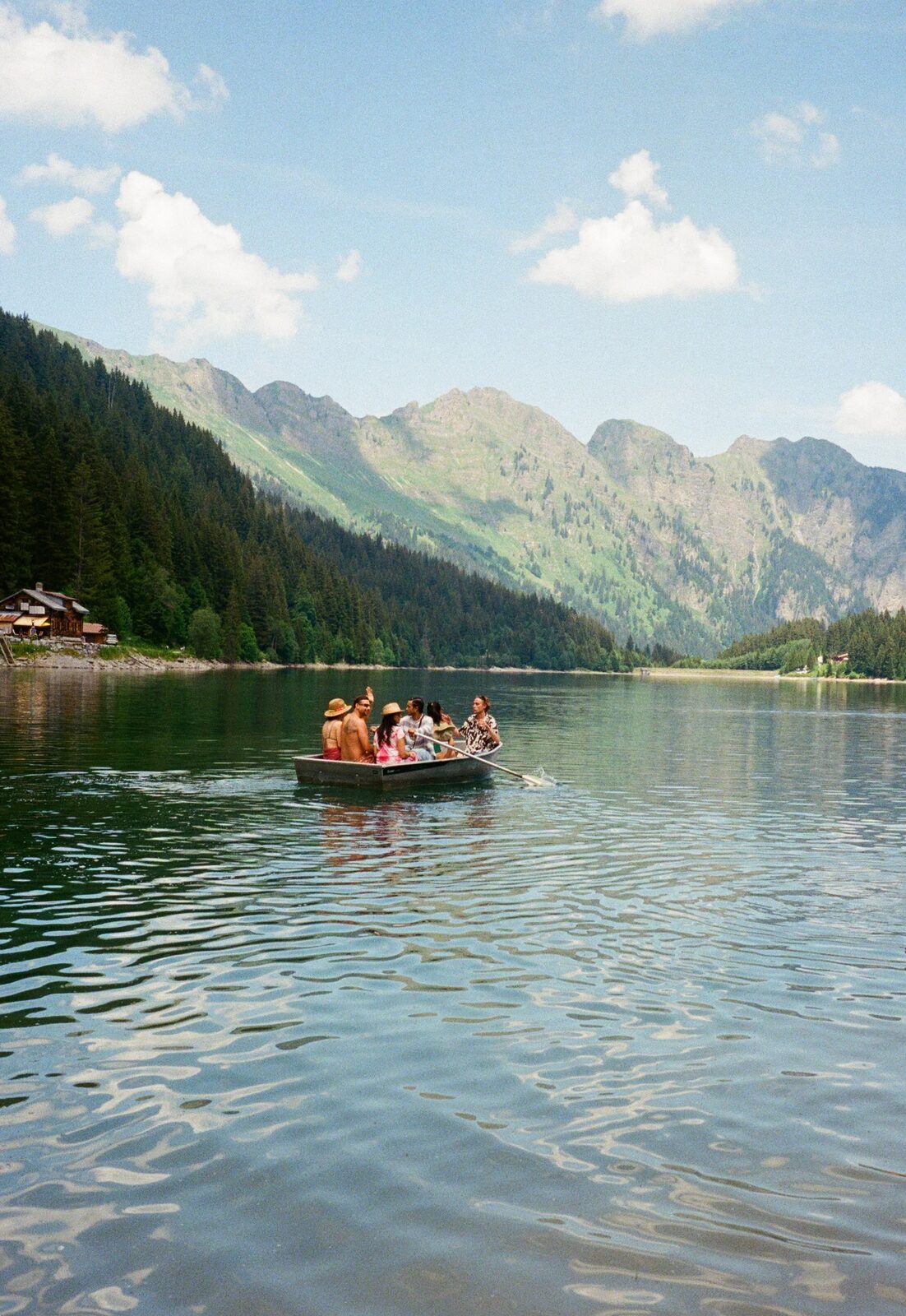 Friends in a rowboat on the lake